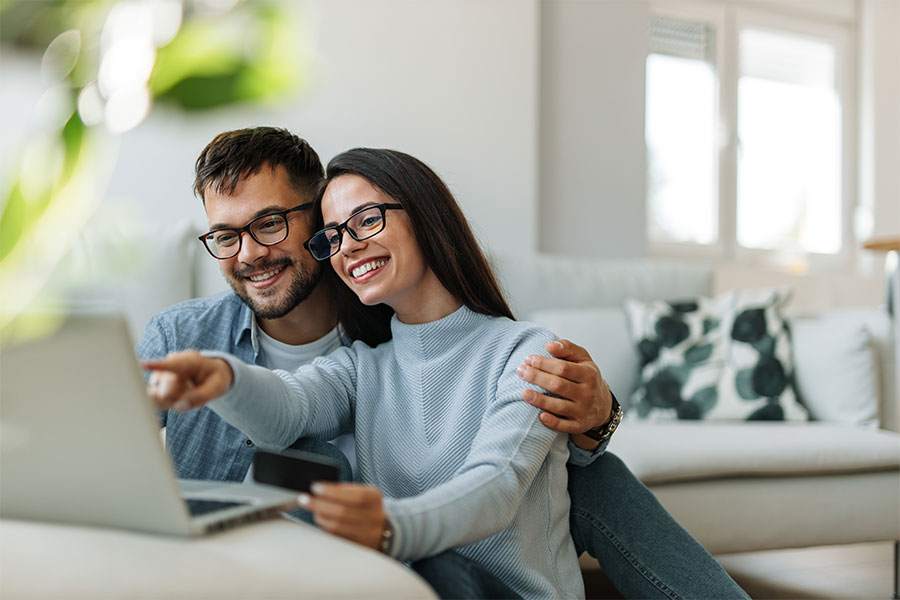 Vocal_Credit_Union_Personal_Loans-Apply_Today Couple applying for a personal bank loan online