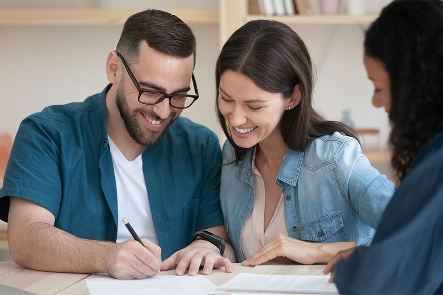 Vocal_Home_Loans-Success_Story Young couple at bank for mobile home loan after returning to Montana